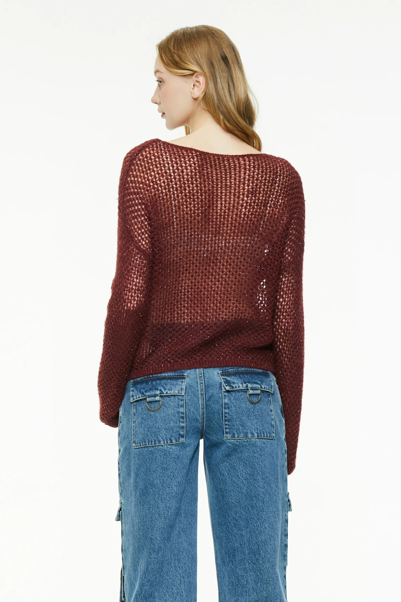 Back view of a burgundy open knit sweater with long sleeves