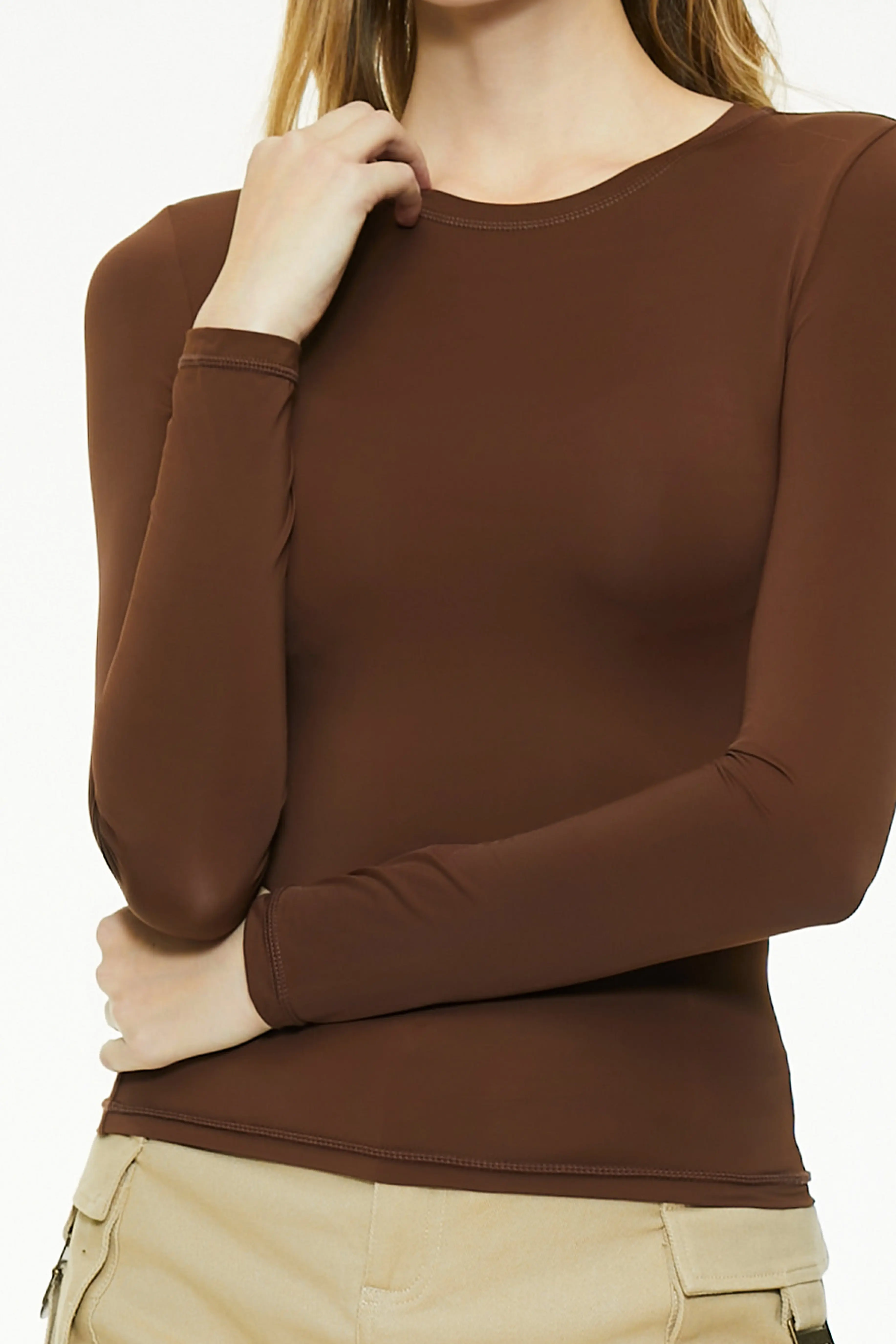 Close-up of a brown fitted long sleeve top