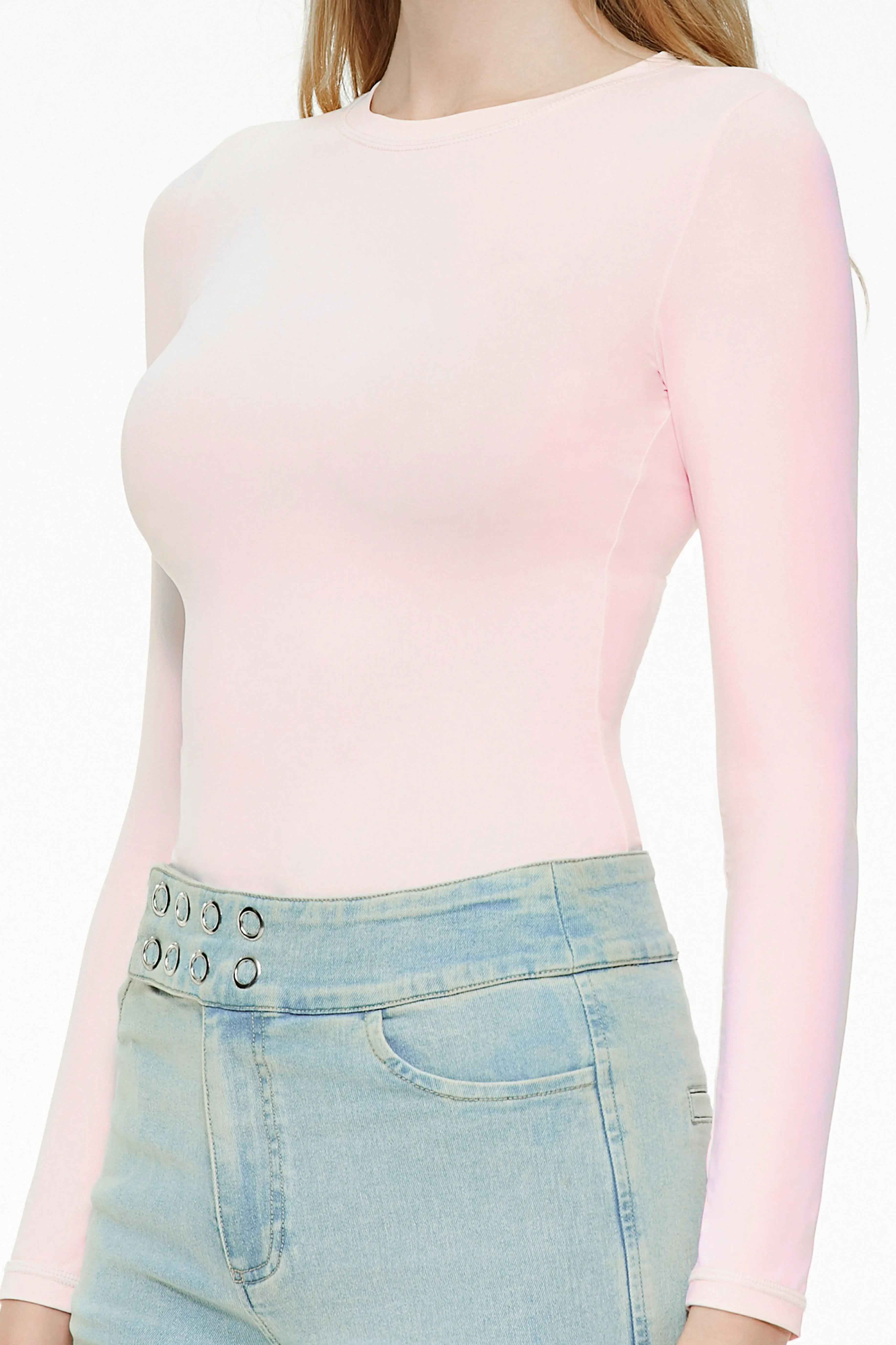 Side detail view of a light pink fitted long sleeve top
