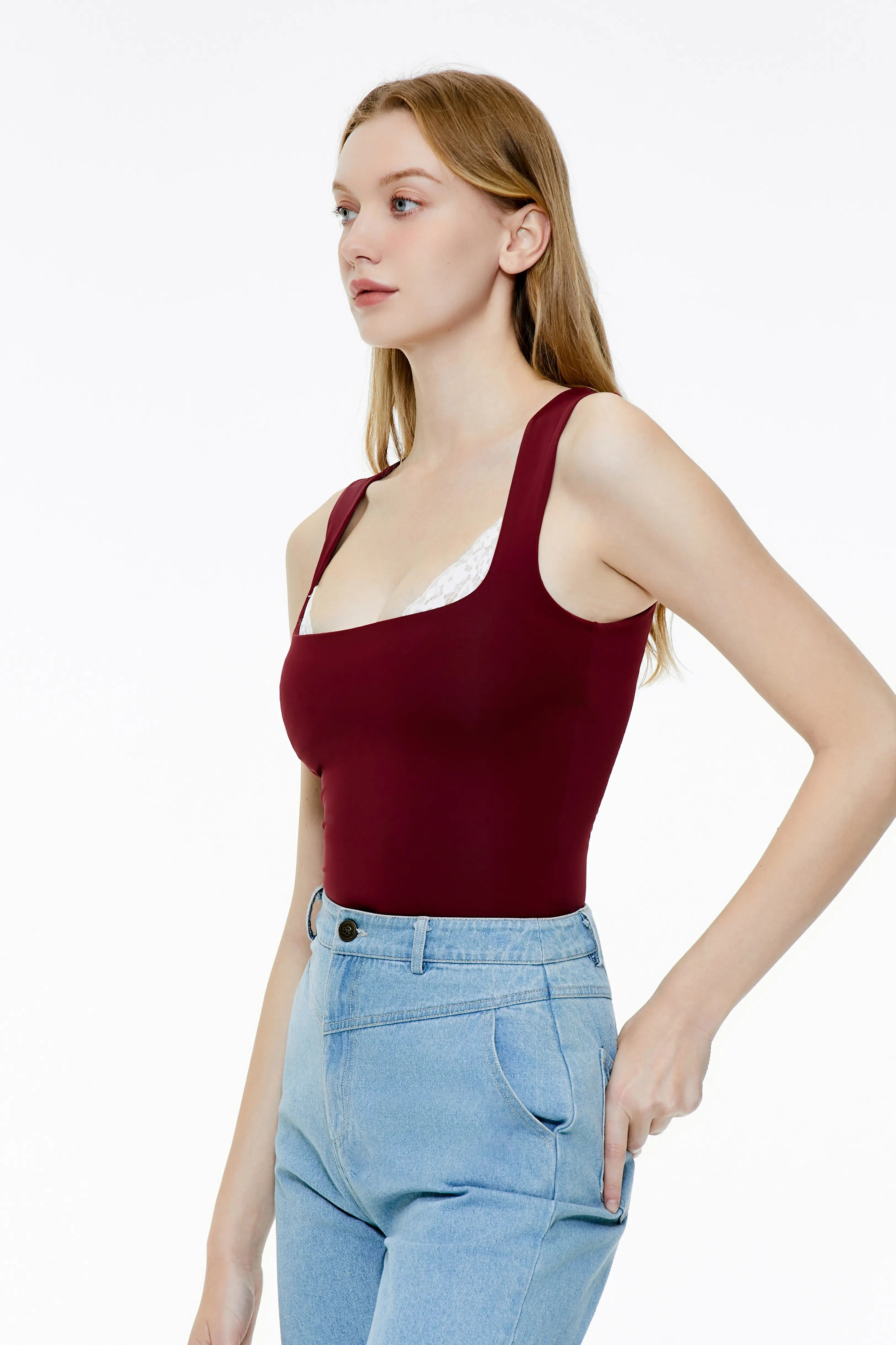 Burgundy lace trim tank top paired with light blue jeans