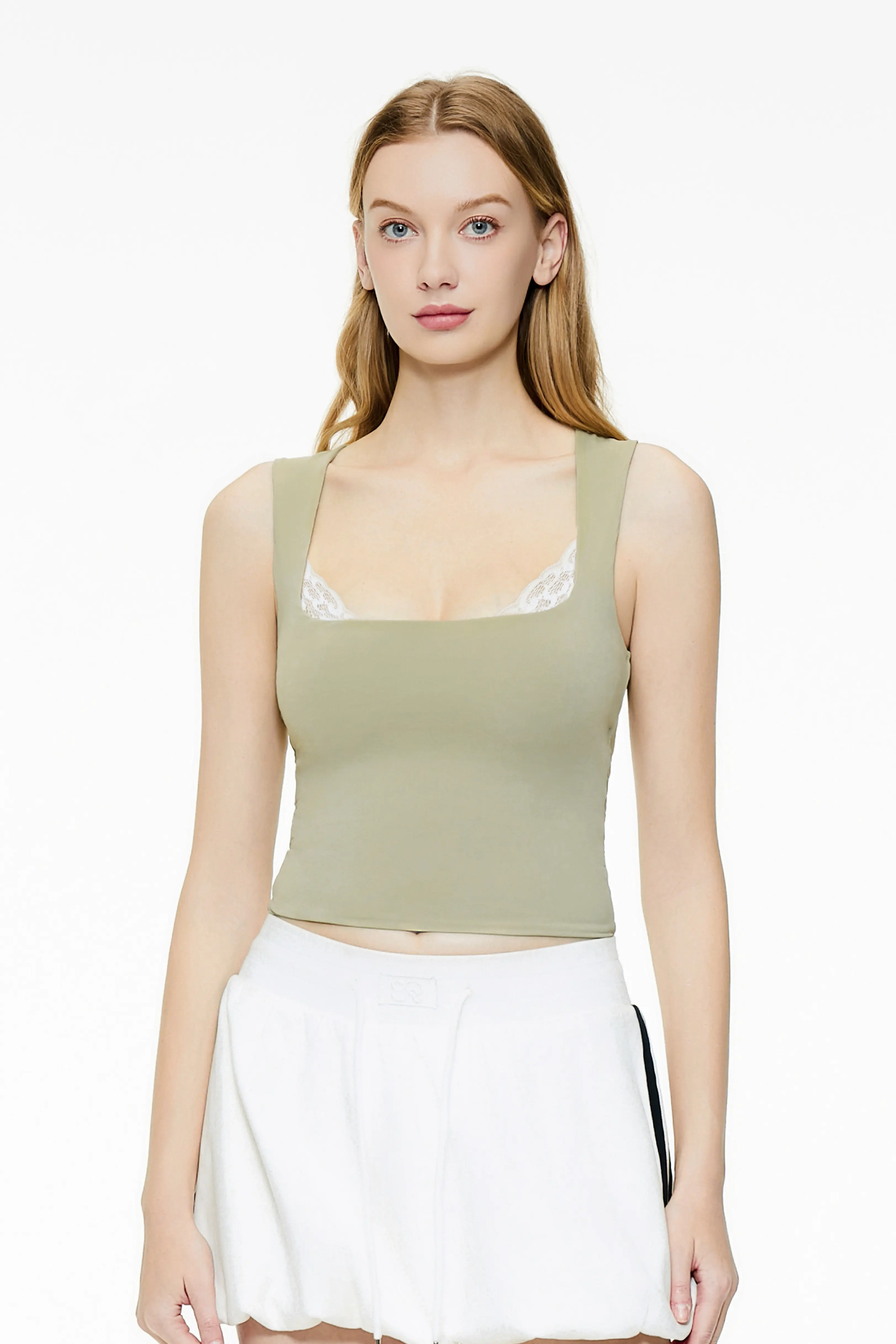 Light green lace trim tank top with a square neckline and a white pleated skirt