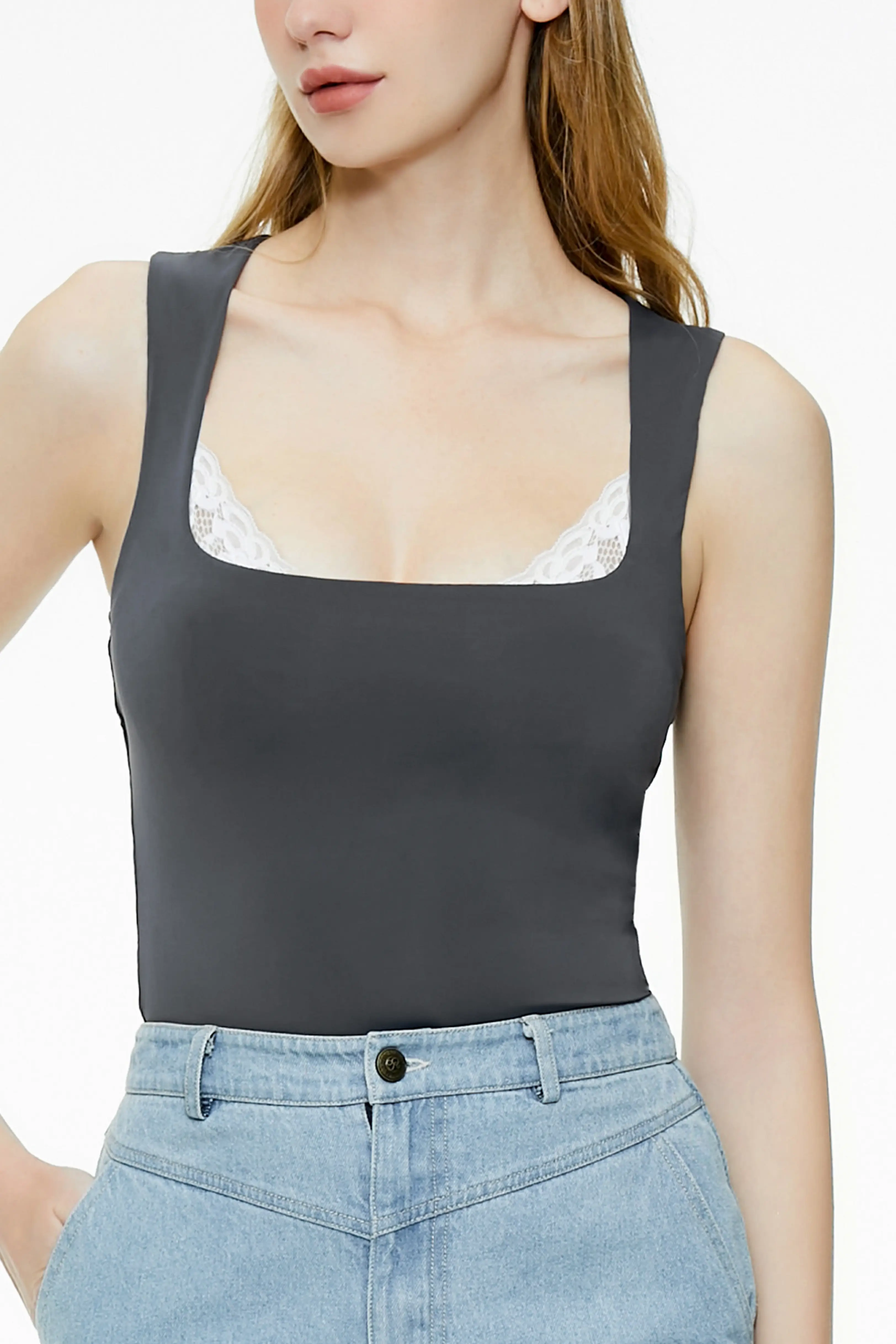 Close-up of a gray-blue lace trim tank top in a cropped fit