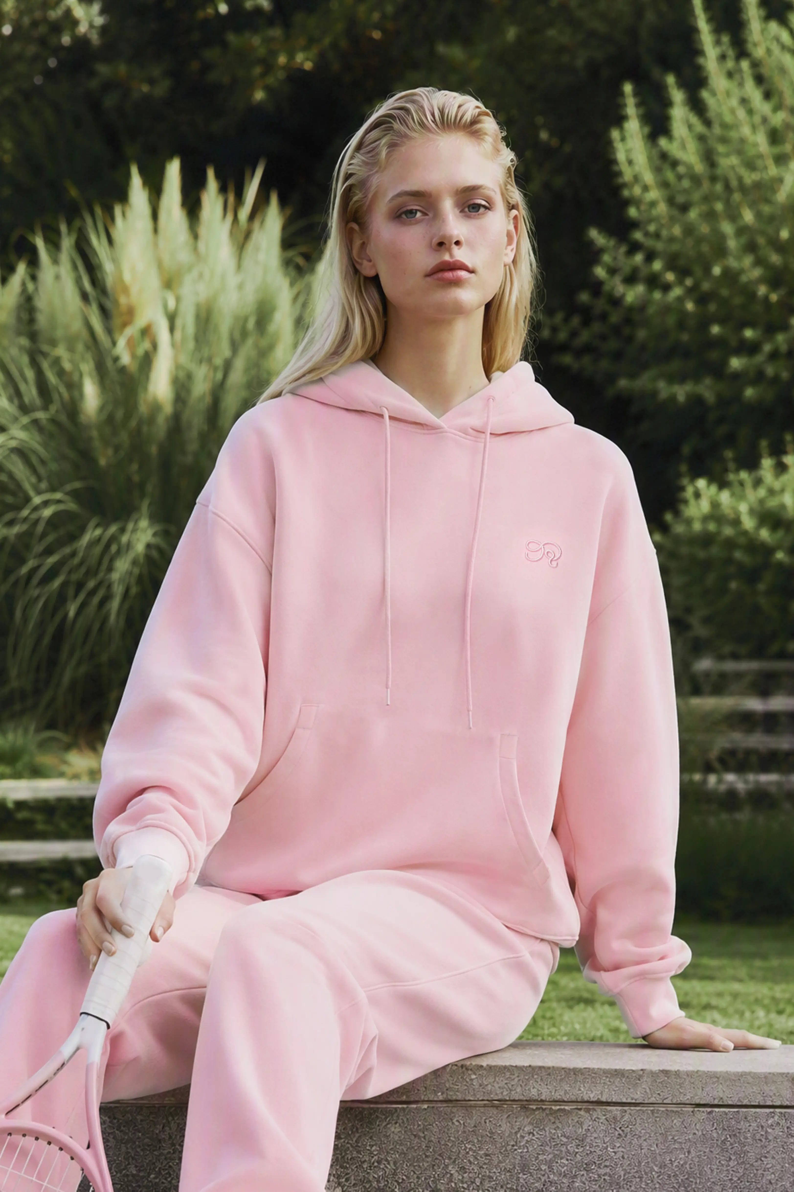 Light blue drop shoulder hoodie showing the front kangaroo pocket and ribbed hem