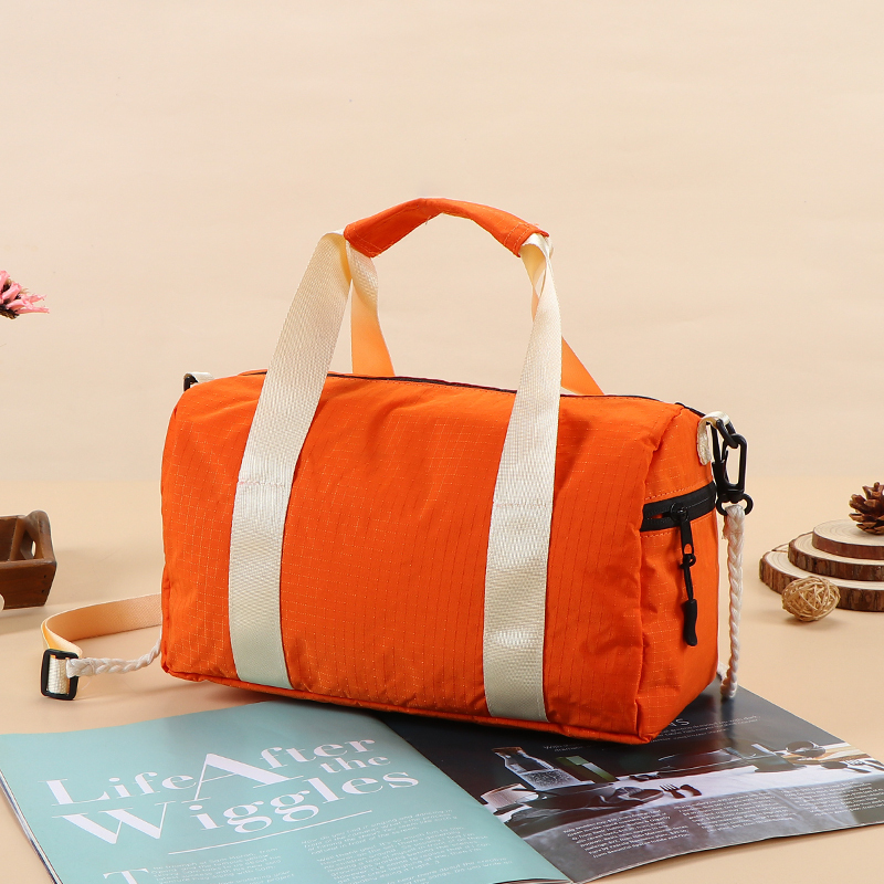 Travel Bag - Lightweight nylon gym bag  - Portable travel duffel  - Detachable shoulder strap bag  - Water-resistant sport tote  - Retro style barrel bag  - Casual crossbody duffel  - Small weekend travel bag,Water-Resistant Nylon Duffel - Durable Wholesale Travel Bags