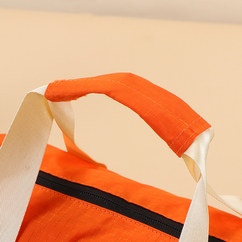 Travel Bag - Lightweight nylon gym bag  - Portable travel duffel  - Detachable shoulder strap bag  - Water-resistant sport tote  - Retro style barrel bag  - Casual crossbody duffel  - Small weekend travel bag,Water-Resistant Nylon Duffel - Durable Wholesale Travel Bags