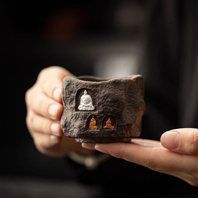 Eartivo "The Stone Sanctuary" - Full view of the handcrafted rock-mineral tea cup with aged clay texture, featuring a hand-applied gold and silver luster shrine, inspired by ancient Dunhuang Grottoes; designed to develop a soulful patina.