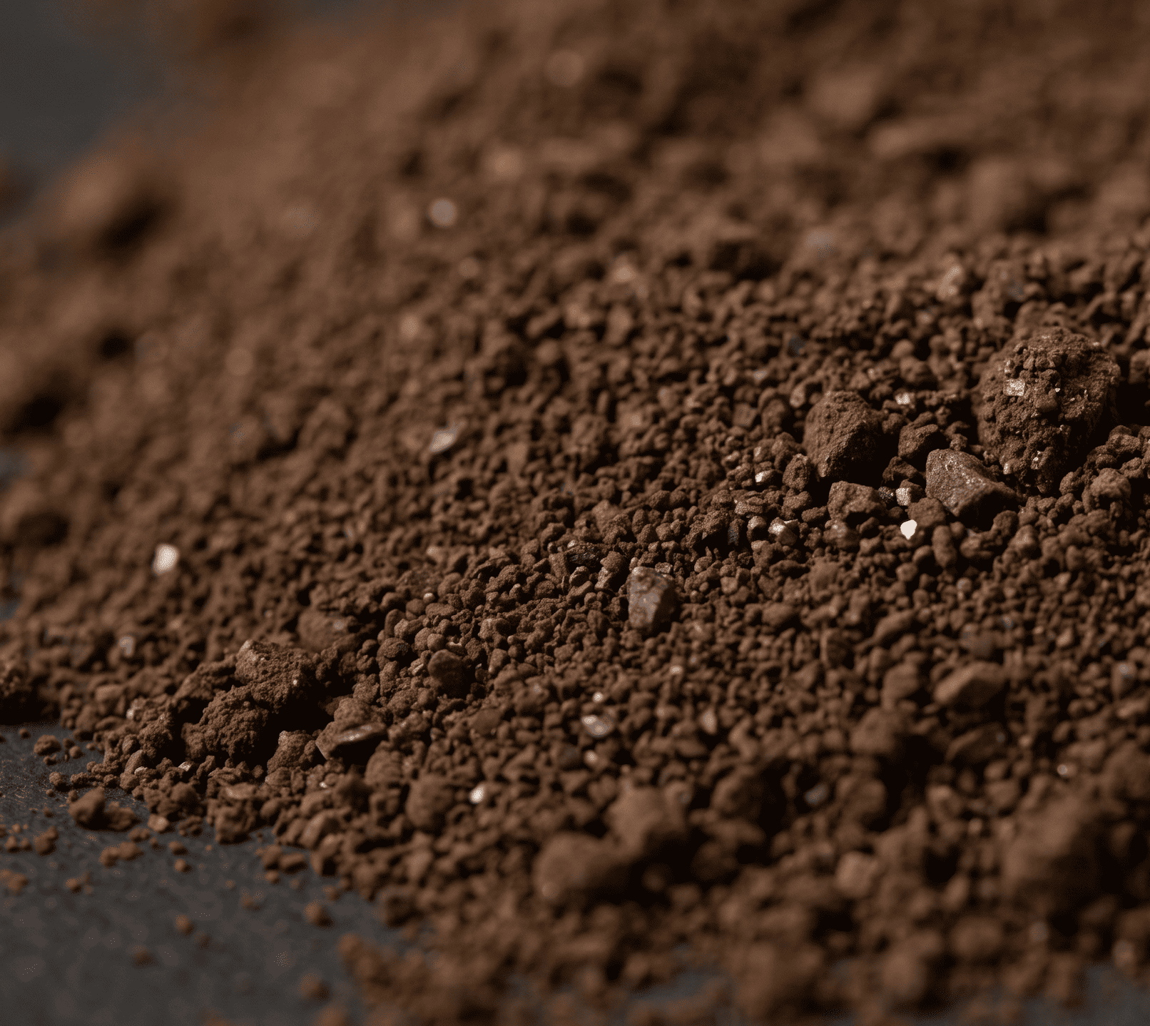 The Stone Sanctuary handmade ceramic cup with deep brown mineral glaze &mdash; coarse-grained texture from quartz and mica particles in rock-mineral clay, wabi sabi ceramics surface