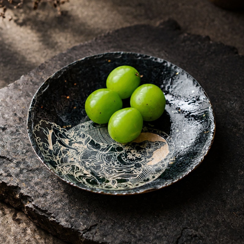 Fresh green fruits served on the handcrafted Midnight Deity decorative plate, highlighting its practical elegance as an artisanal tea table center dish.