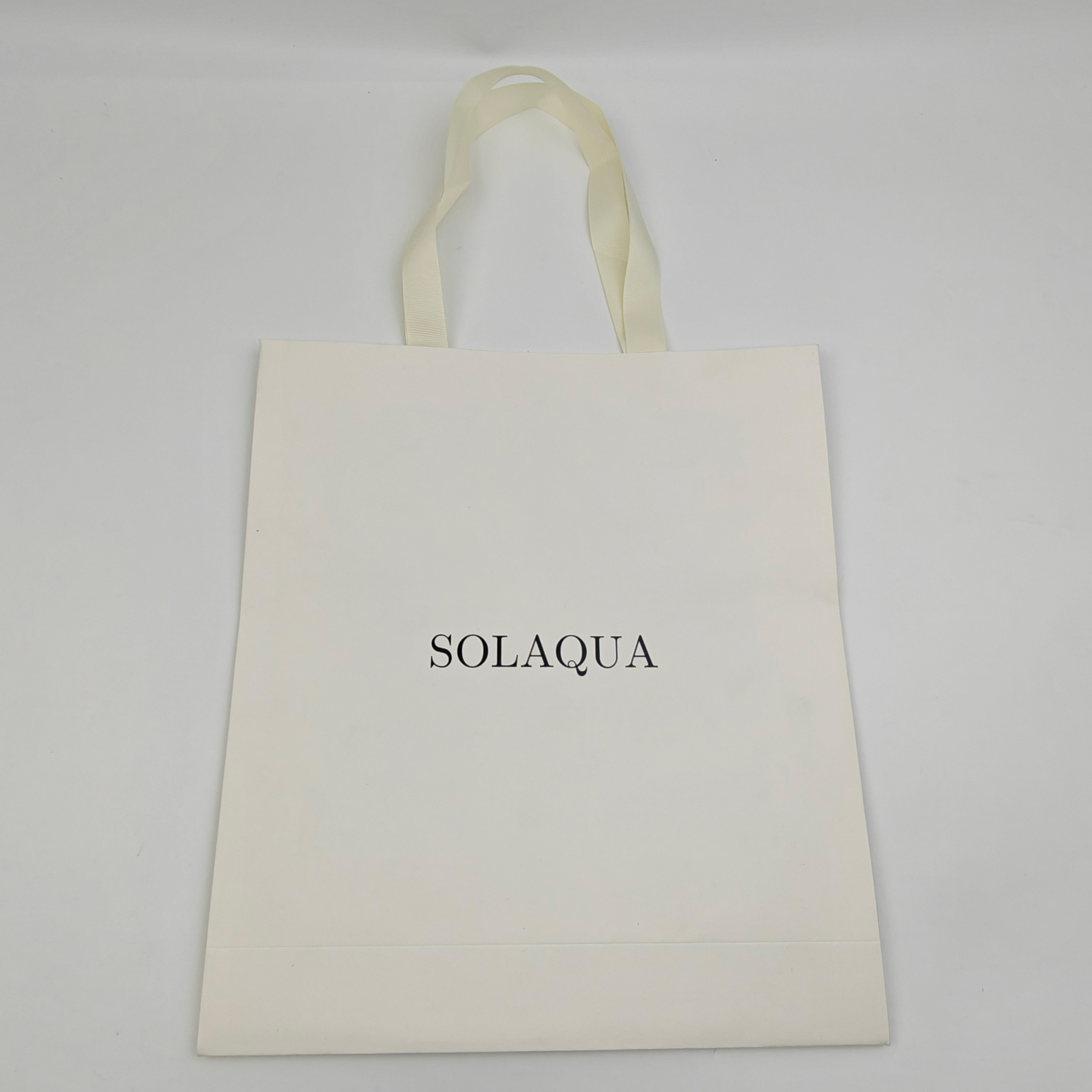 Custom White Kraft Gift Bags with Black Foil Logo & Ribbon Handles