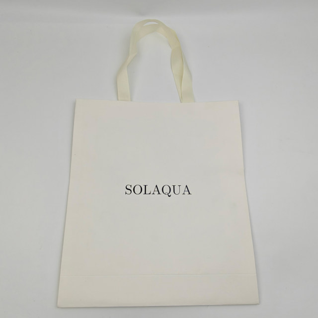 Custom White Kraft Gift Bags with Black Foil Logo & Ribbon Handles