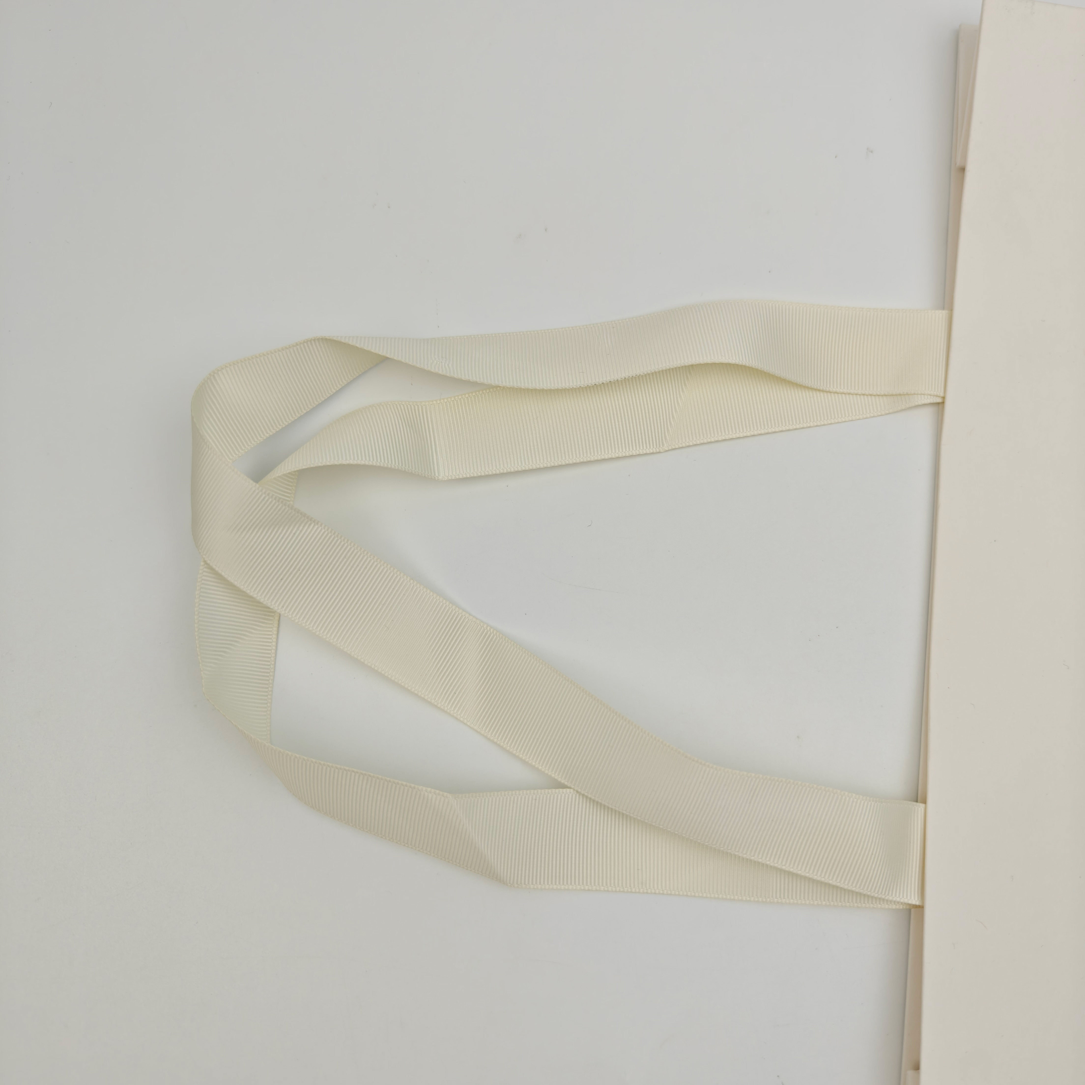 Custom White Kraft Gift Bags with Black Foil Logo & Ribbon Handles