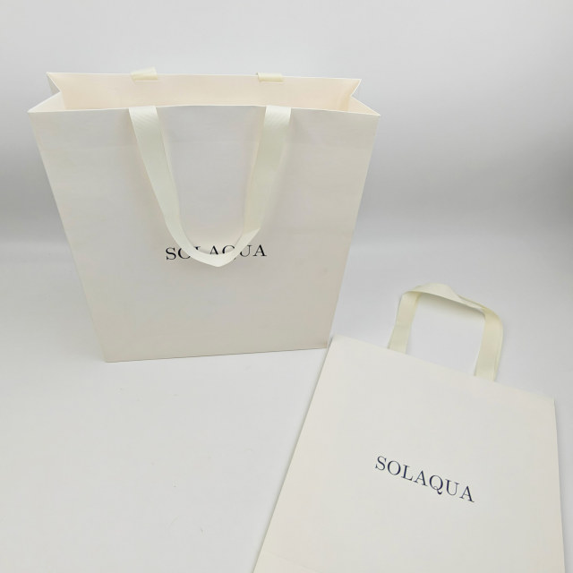 Custom White Kraft Gift Bags with Black Foil Logo & Ribbon Handles