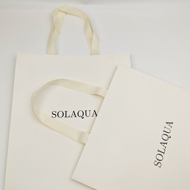 Custom White Kraft Gift Bags with Black Foil Logo & Ribbon Handles