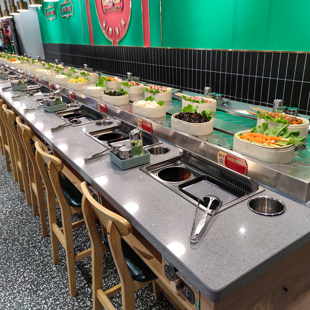 Revolving grill and hot pot table