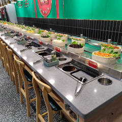 Revolving grill and hot pot table
