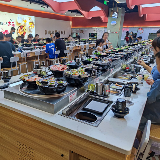 Revolving grill and hot pot table