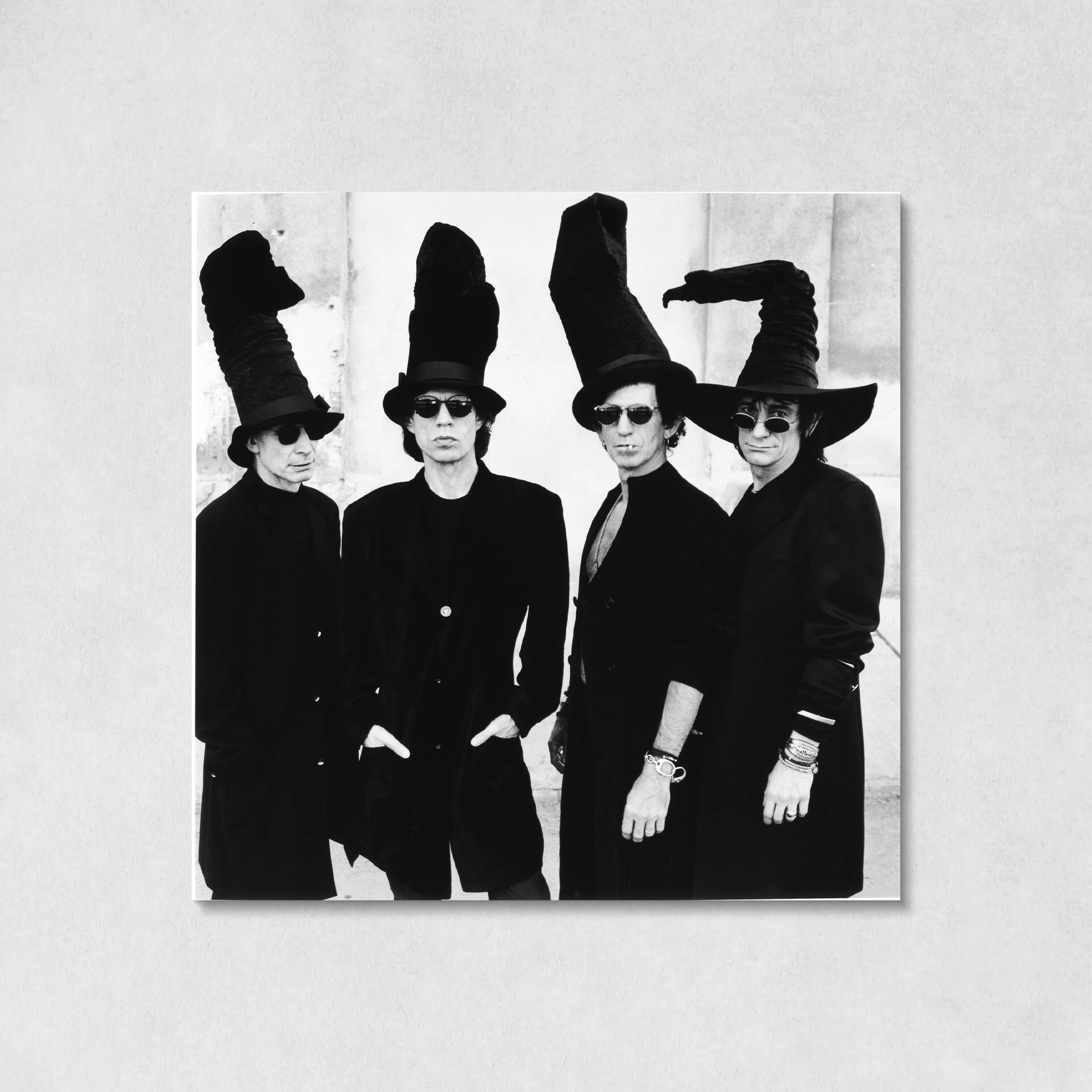 The Rolling Stones Wearing Black Wizard Hat Canvas Wall Art