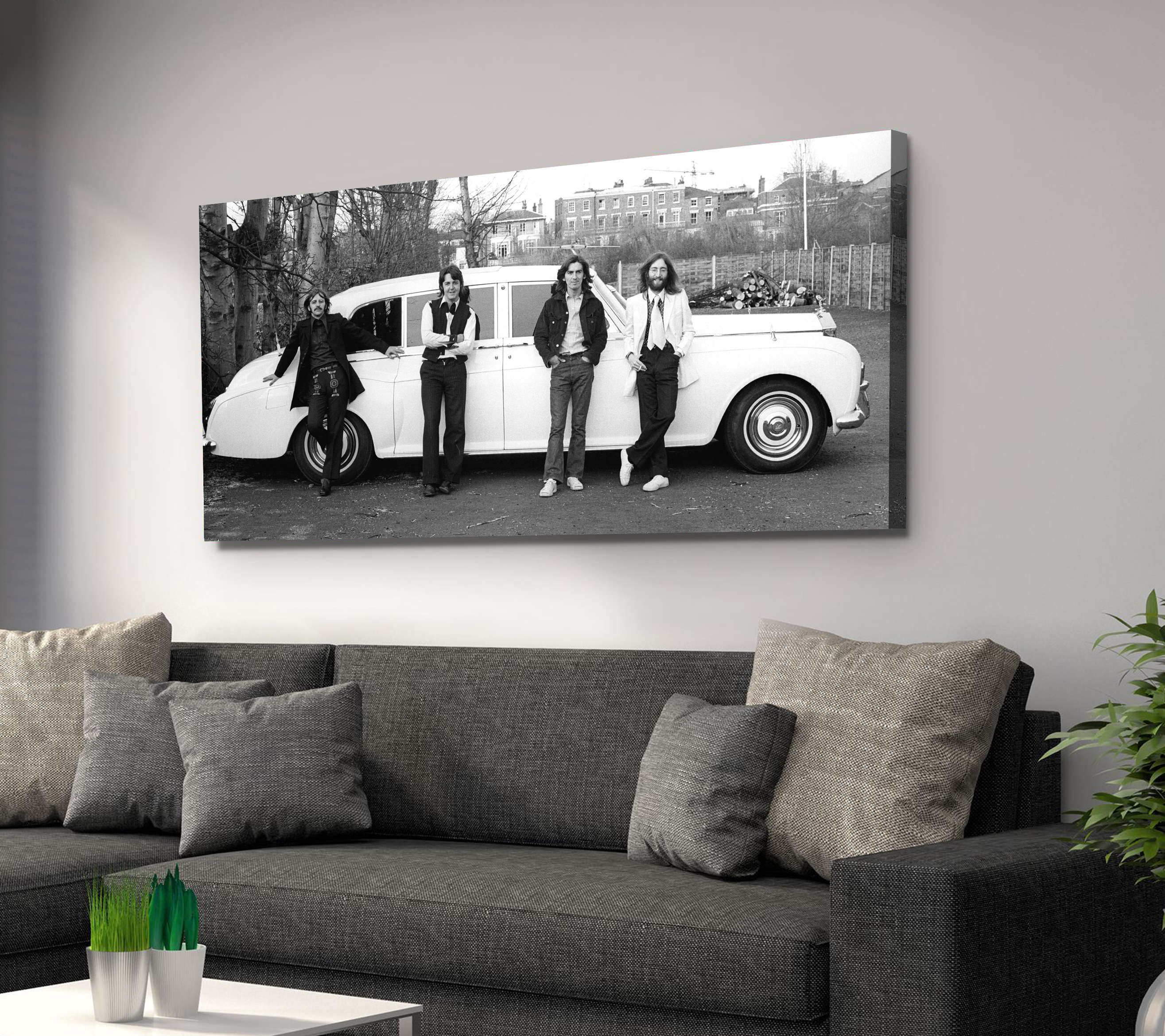The Beatles in front of John Lennon's Rolls Royce Phantom. 1969 Canvas Art
