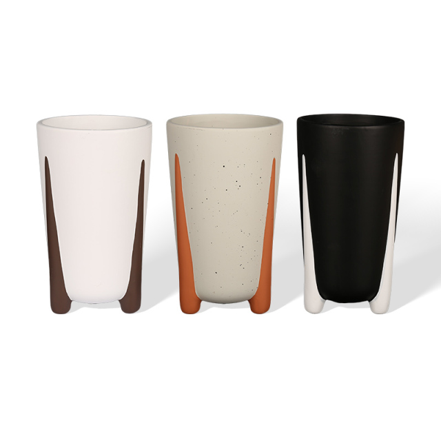 White porcelain flower pot with simple three legs and cement paint