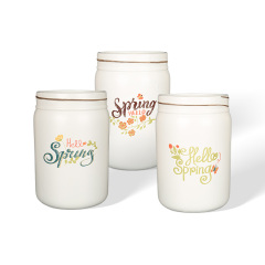Wholesale Hello Spring! A ceramic flower pot with a floral print design.