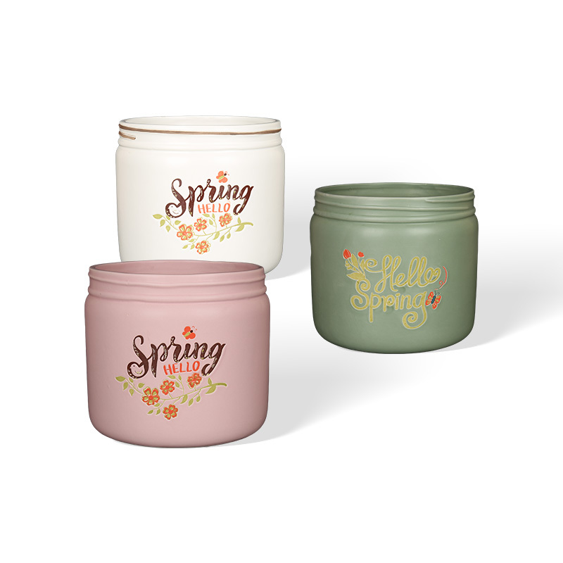 Wholesale Hello Spring! A ceramic flower pot with a floral print design.