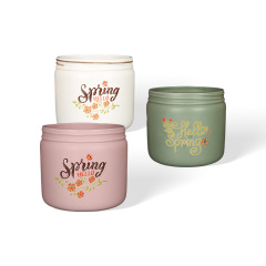 Wholesale Hello Spring! A ceramic flower pot with a floral print design.