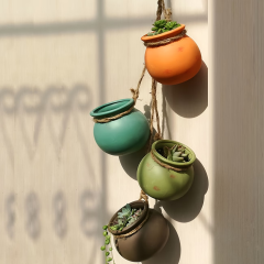 Wholesale of Seriated Ceramic Hanging Flower Pots with Rope Strands