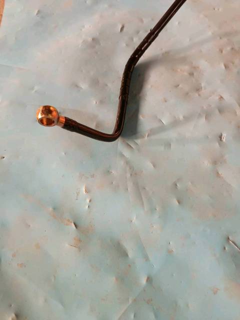 Range guard formed hose assembly