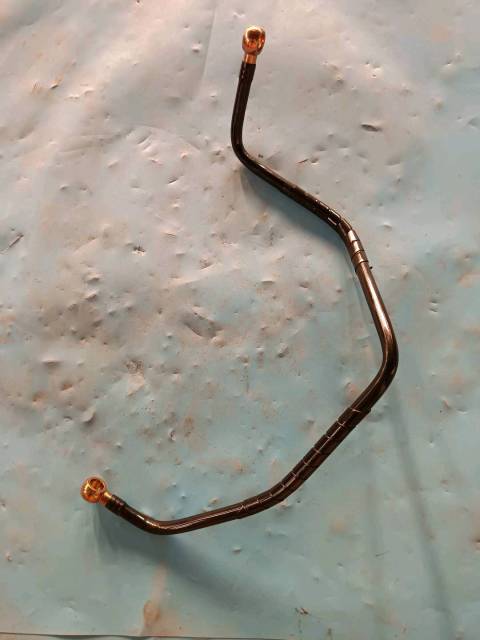 Range guard formed hose assembly