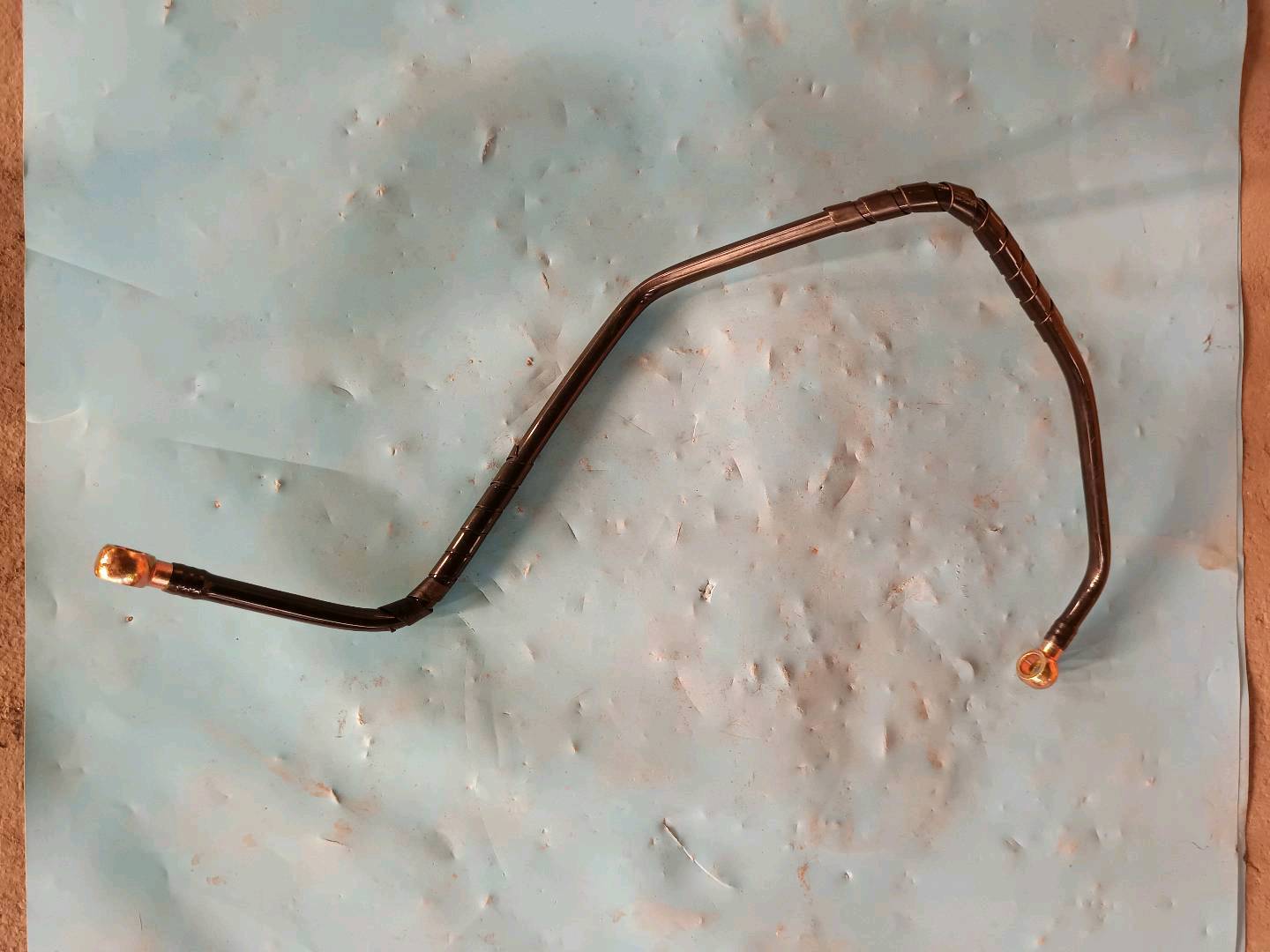 Range guard formed hose assembly