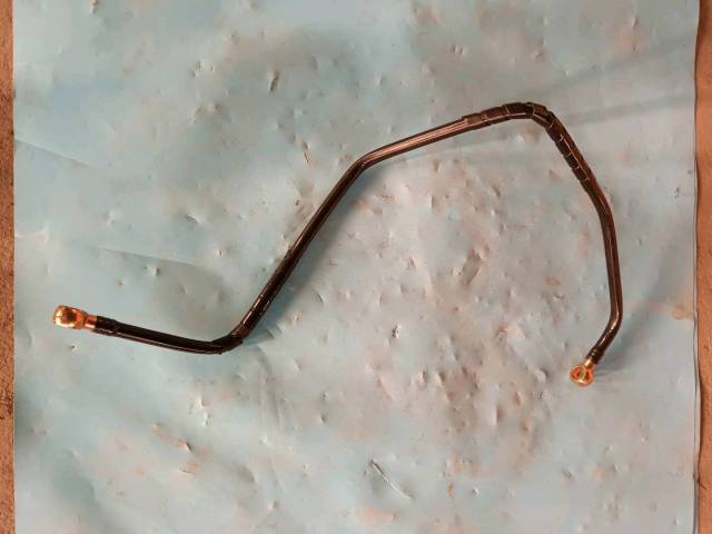 Range guard formed hose assembly