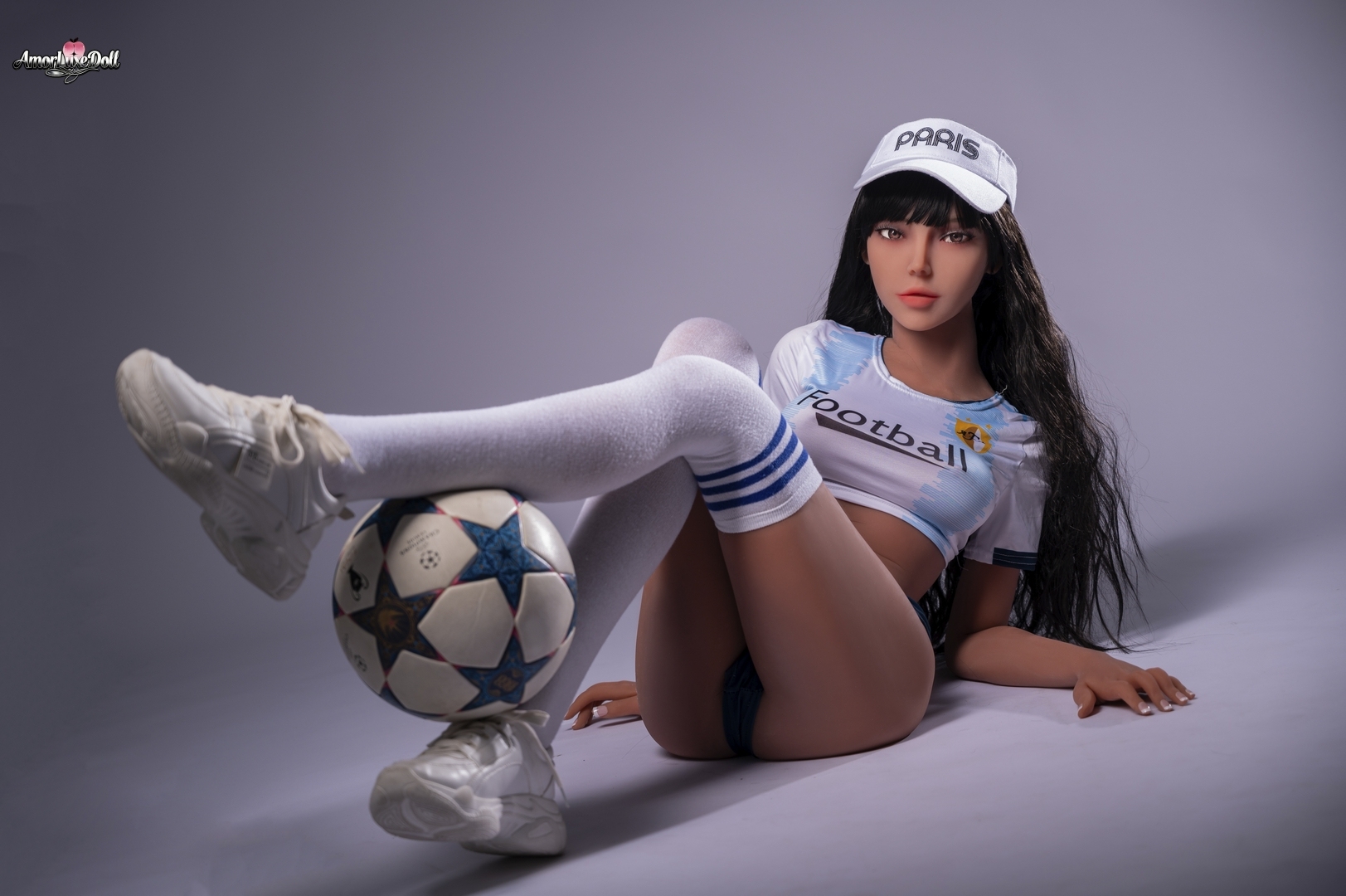 Evangeline realistic doll with football-inspired outfit, knee socks, and soft skin texture