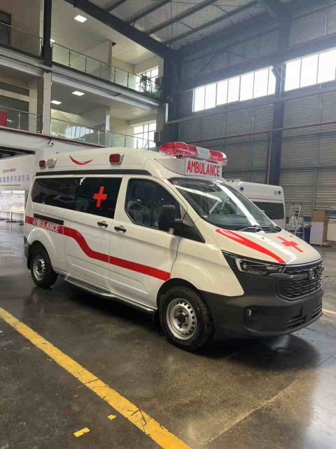 Ford National VI gasoline ambulance with raised bumper and long exhaust lights