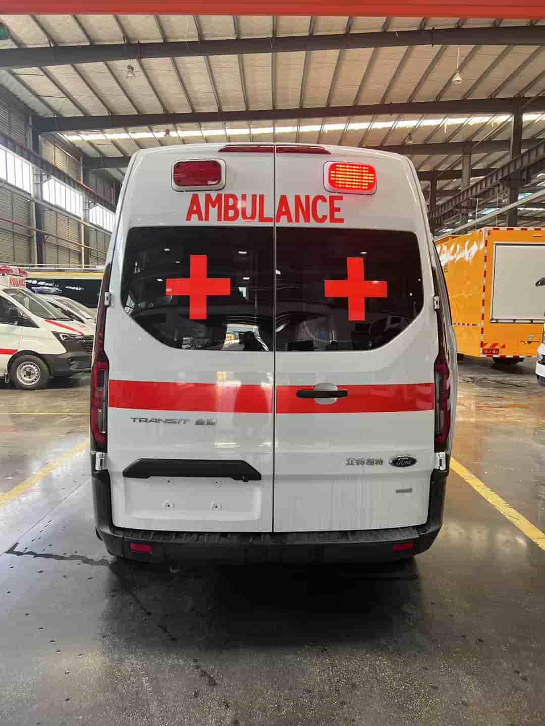 Ford National VI gasoline ambulance with raised bumper and long exhaust lights