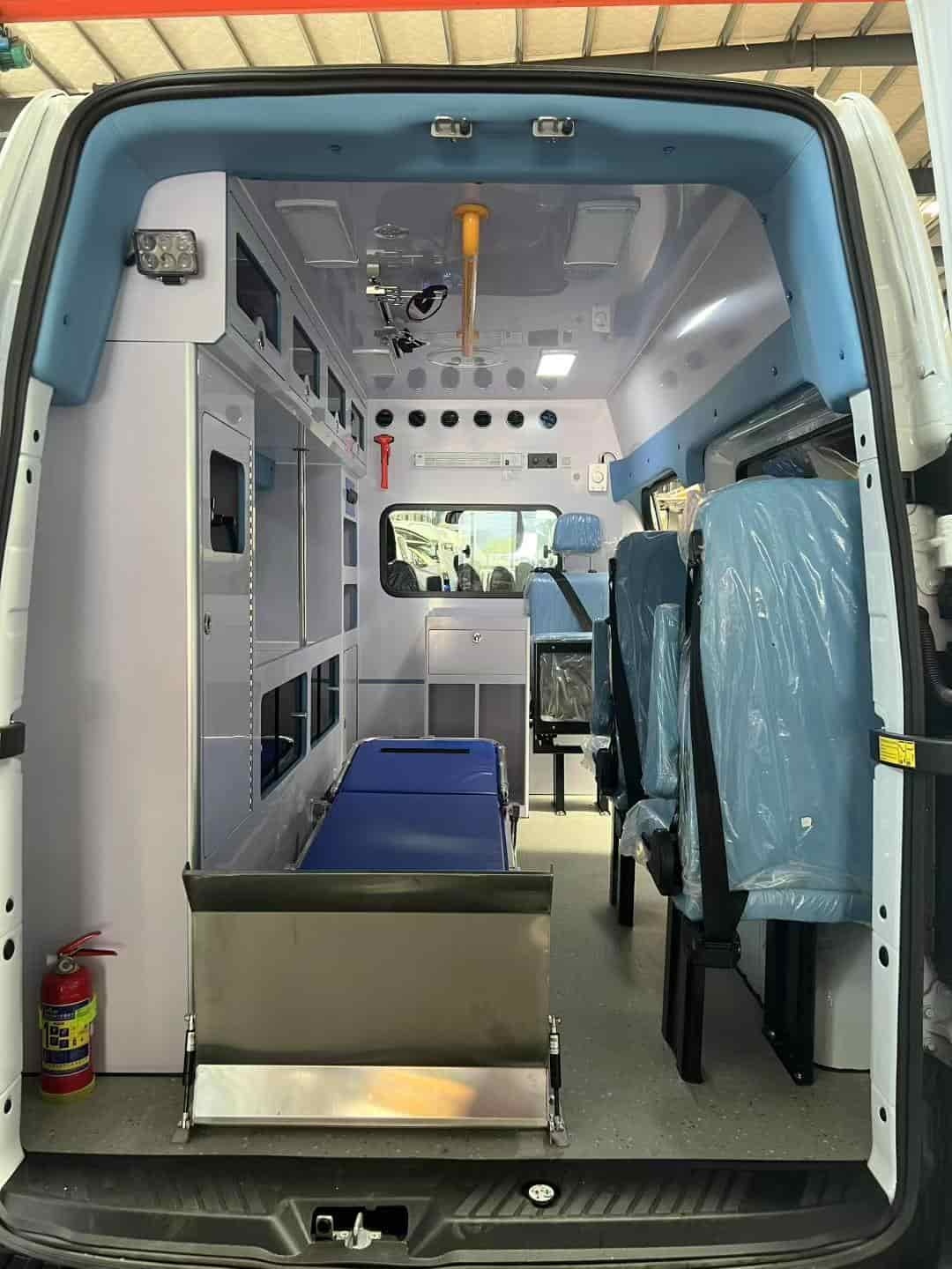Ford National VI gasoline ambulance with raised bumper and long exhaust lights