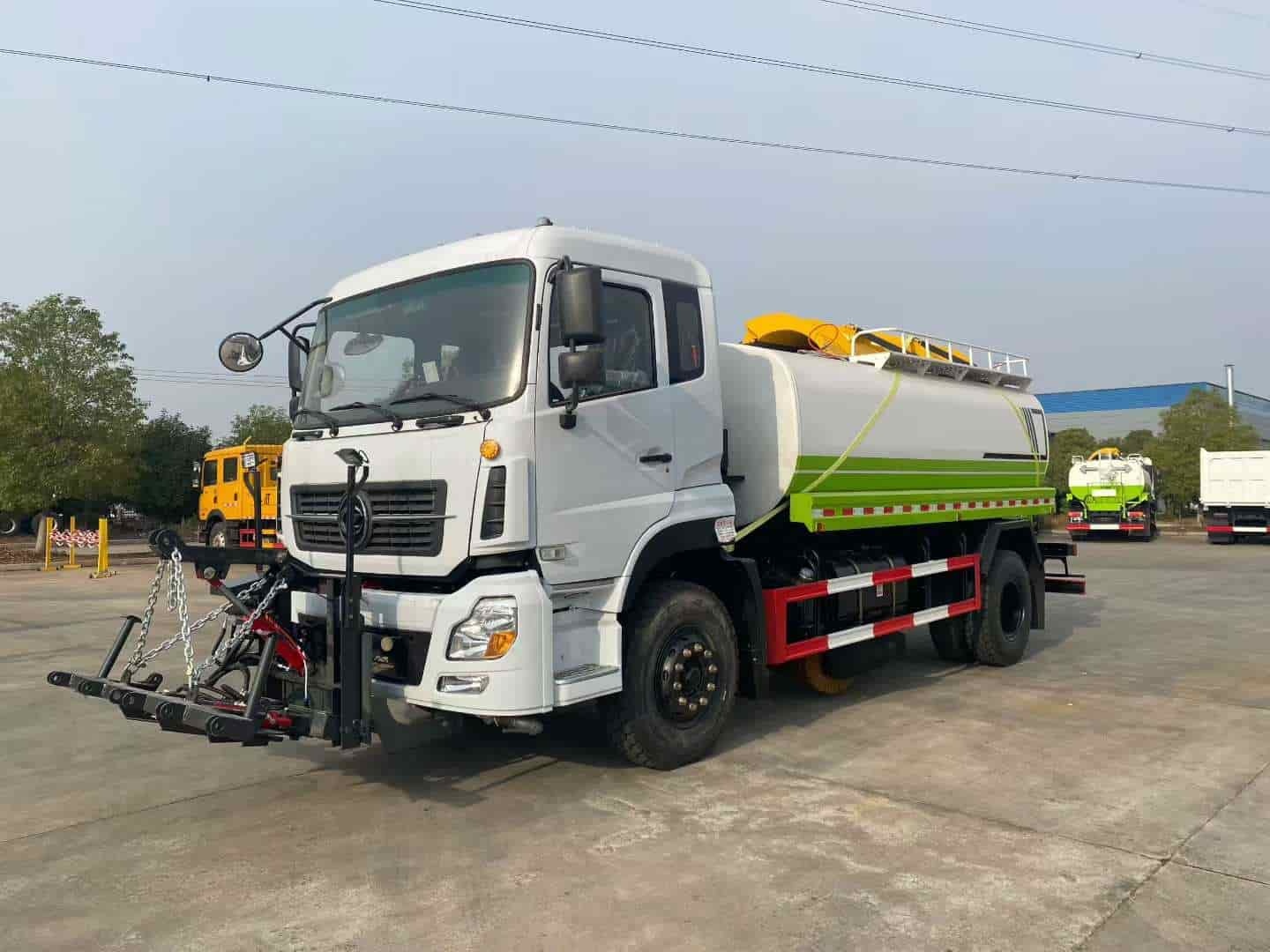 Water trucks equipped with a centrally mounted ice-breaking tool can be used in conjunction with a front-mounted snowplow.