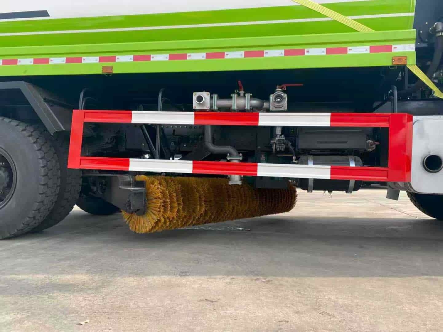 Water trucks equipped with a centrally mounted ice-breaking tool can be used in conjunction with a front-mounted snowplow.