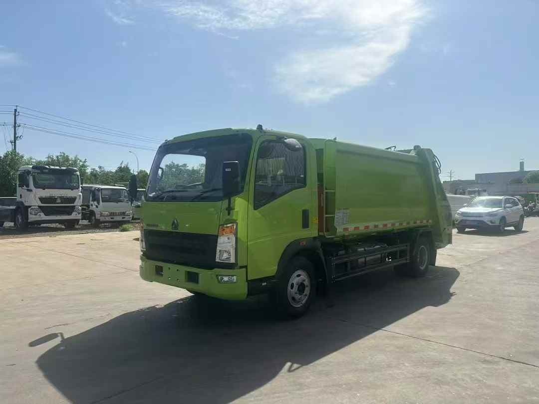 Sinotruk compressed garbage truck customized apple green