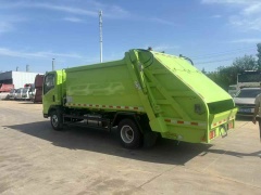 Sinotruk compressed garbage truck customized apple green