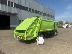 Sinotruk compressed garbage truck customized apple green