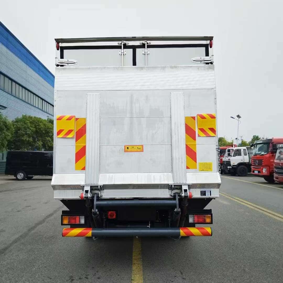 Isuzu KV600 insulated car with hydraulic tailboard