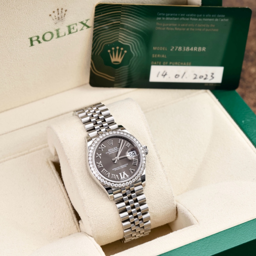 Rolex Datejust, lunetta con diamanti, numeri romani grigi, Vie diamanti, 31 mm.