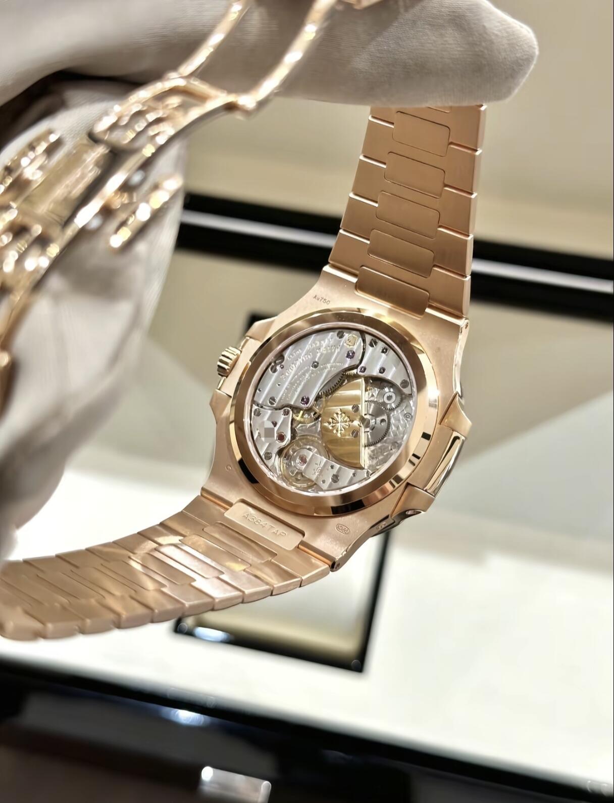 Orologio da uomo Patek Philippe Nautilus 5712 in oro rosa con quadrante marrone, fasi lunari e riserva di carica, movimento automatico meccanico complicato
