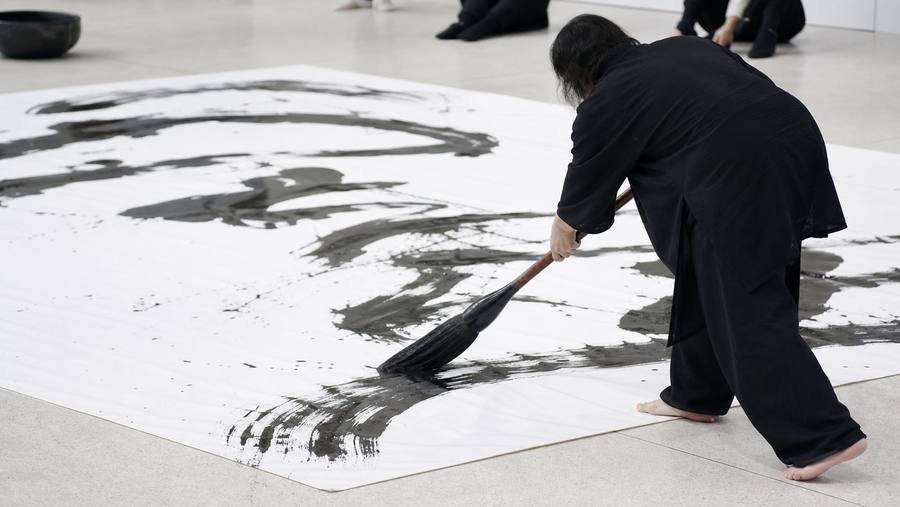 Large-scale live Chinese calligraphy performance with oversized brush