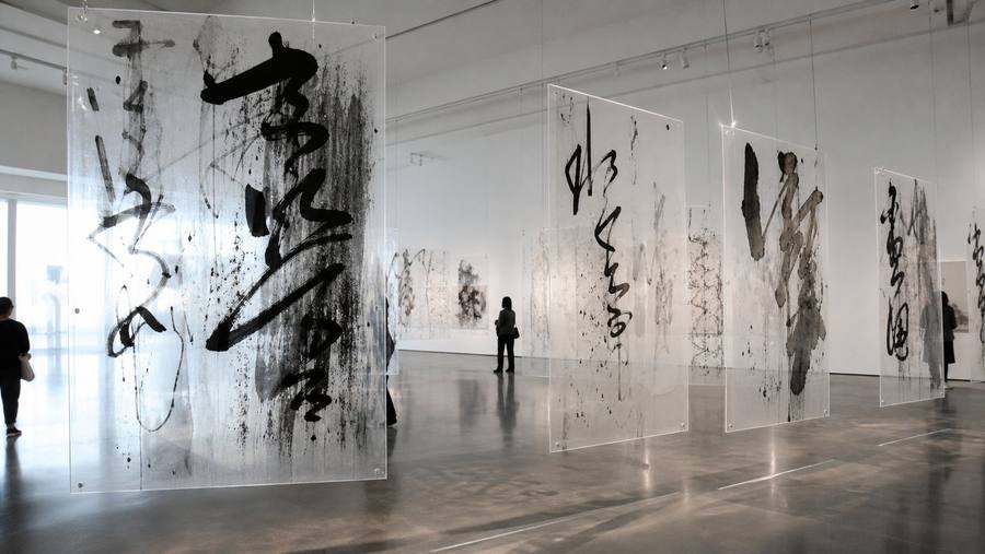 Contemporary museum installation of abstract Chinese ink calligraphy panels