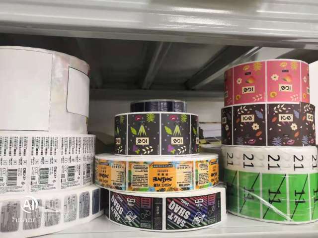 Multiple material adhesive stickers