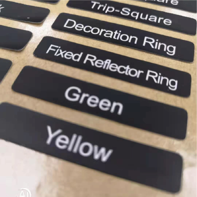 Multiple material adhesive stickers