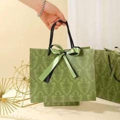 Vintage olive green patterned luxury gift paper bags with satin bow ribbon