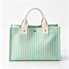 Striped canvas tote bag with snap‑button