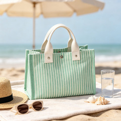 Striped canvas tote bag with snap‑button